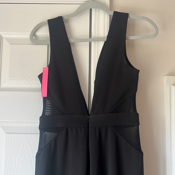 NWT - Vici Dolls Black Jumpsuit with Mesh Sides Flared Legs - Size L runs small - Picture 4 of 4